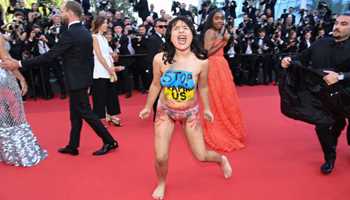 “Stop Raping Us’, topless woman protests against Russian invasion at Cannes Film Festival